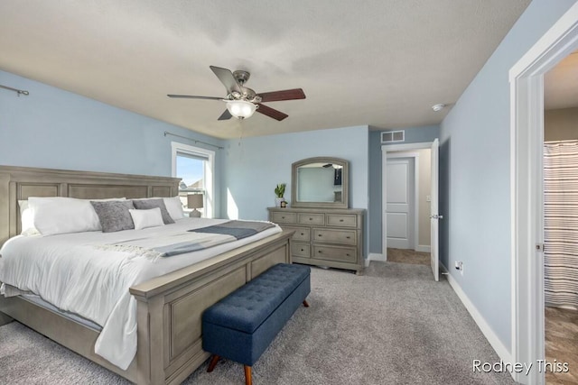 bedroom featuring carpet flooring, baseboards, visible vents, and ceiling fan