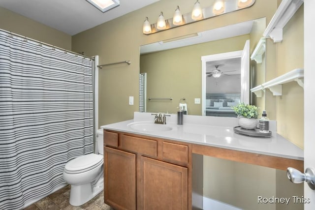 full bathroom with vanity, toilet, and ceiling fan