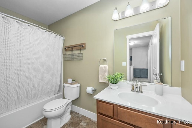 bathroom featuring vanity, toilet, shower / bathtub combination with curtain, and baseboards