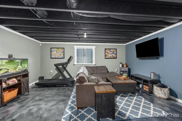 living room featuring finished concrete flooring and baseboards