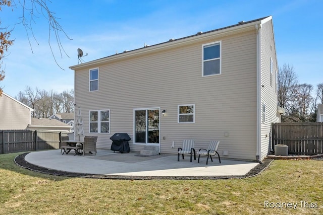 rear view of property with a patio, central AC unit, a lawn, and fence