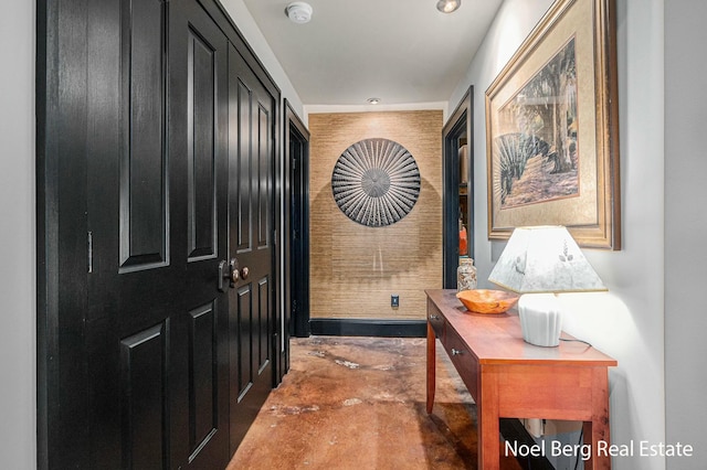 doorway to outside with unfinished concrete flooring