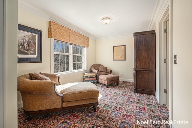 sitting room featuring baseboards and crown molding