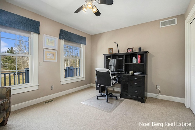 office with light carpet, visible vents, and baseboards