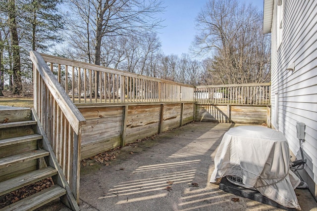 view of patio / terrace with a wooden deck and area for grilling