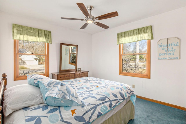 carpeted bedroom with a ceiling fan and baseboards