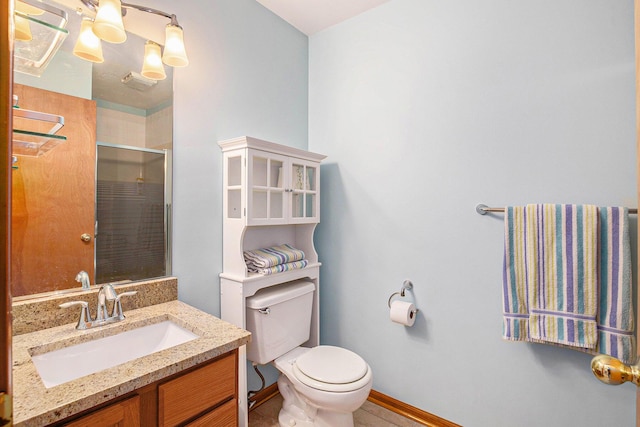 full bathroom with toilet, a stall shower, tile patterned flooring, baseboards, and vanity