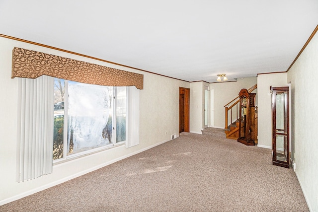 unfurnished room with crown molding, stairway, carpet, and baseboards