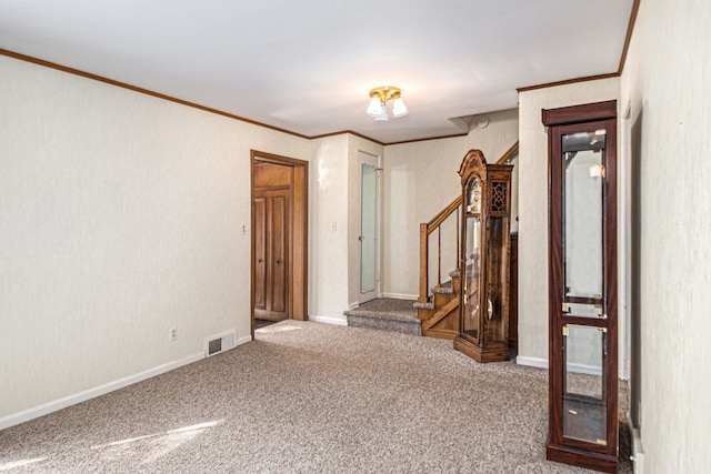 carpeted spare room with stairs, baseboards, visible vents, and ornamental molding