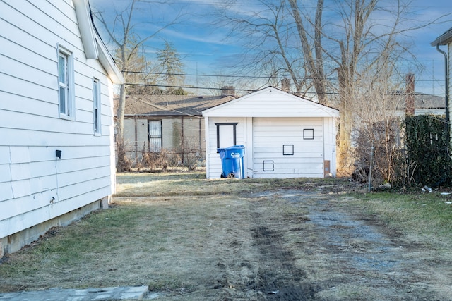 detached garage featuring driveway