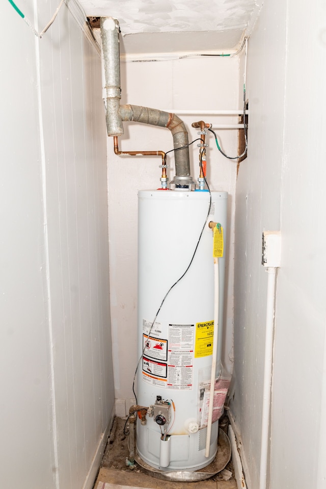 utility room featuring water heater