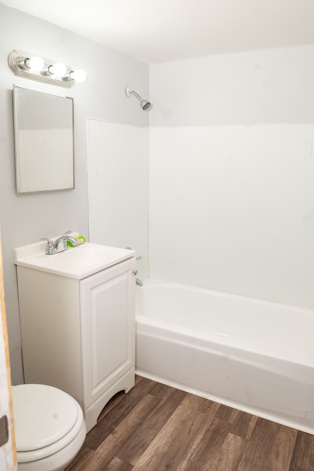 full bathroom with vanity, shower / bathing tub combination, toilet, and wood finished floors