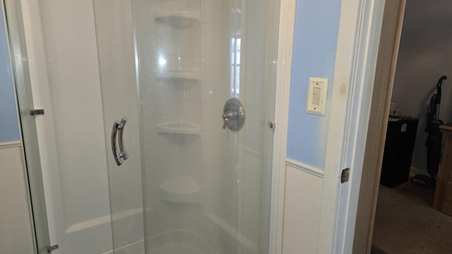 full bath featuring a shower stall