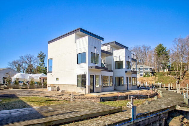 1 N Bailey Ave # 1, South Haven, MI 49090 - back of property with a balcony and central AC unit