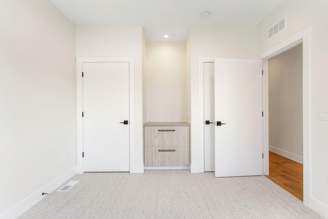 1 N Bailey Ave # 1, South Haven, MI 49090 - unfurnished bedroom with baseboards, recessed lighting, and light colored carpet