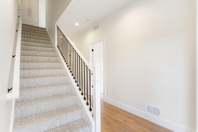 1 N Bailey Ave # 1, South Haven, MI 49090 - staircase featuring wood finished floors, recessed lighting, and baseboards