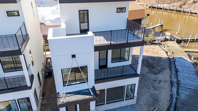 1 N Bailey Ave # 1, South Haven, MI 49090 - back of property with a balcony, a water view, and cooling unit