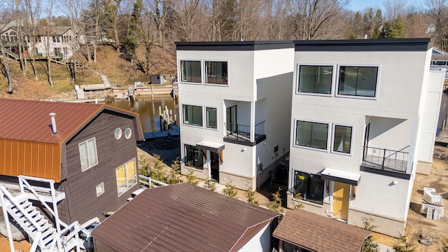 1 N Bailey Ave # 1, South Haven, MI 49090 - back of property featuring stucco siding and a water view