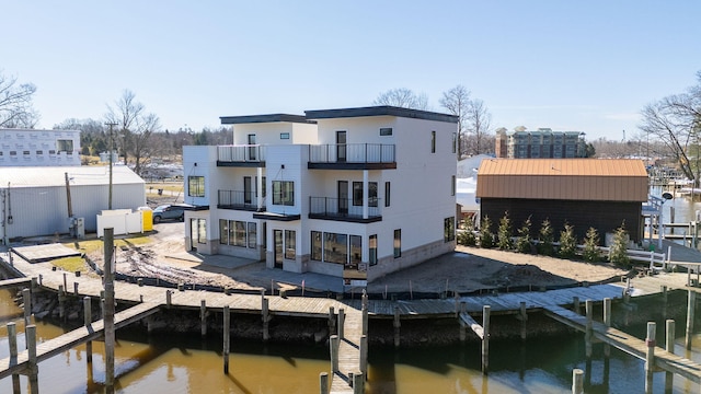 1 N Bailey Ave # 1, South Haven, MI 49090 - back of property with a balcony, a water view, and a patio area