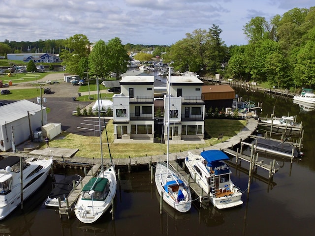 1 N Bailey Ave # 1, South Haven, MI 49090 - dock with a balcony, a water view, and a yard