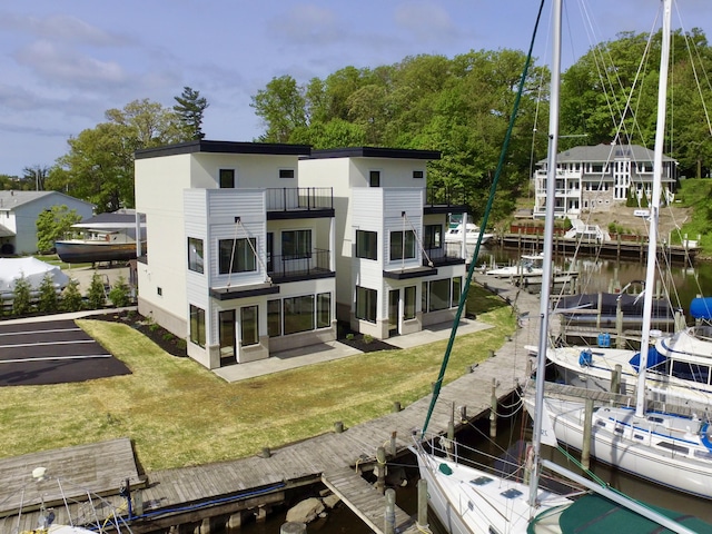 1 N Bailey Ave # 1, South Haven, MI 49090 - dock featuring a yard, a water view, and a balcony