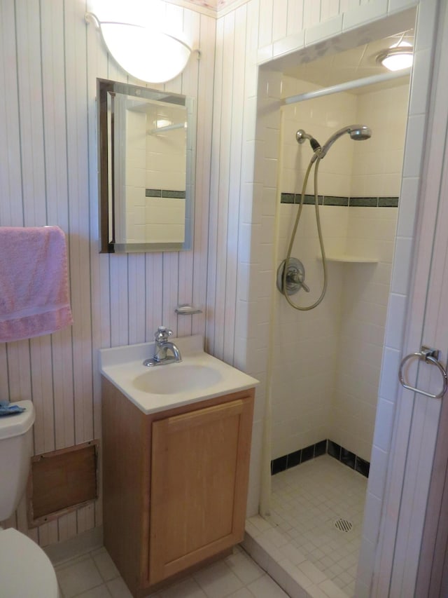 full bath with a shower stall, toilet, and vanity