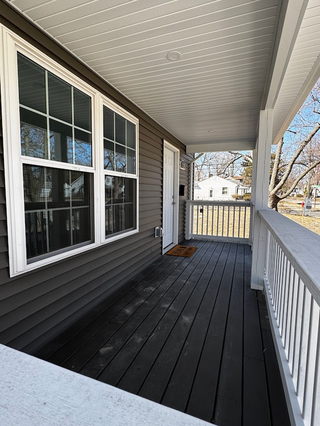 wooden terrace featuring covered porch