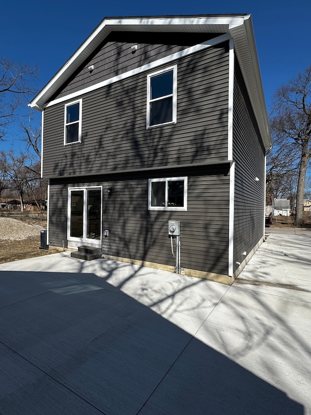 rear view of property featuring entry steps