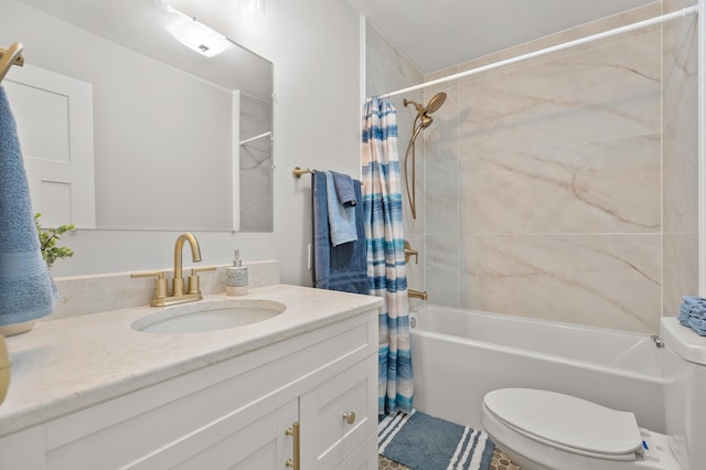 bathroom featuring toilet, vanity, and shower / bath combo