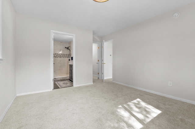 unfurnished bedroom featuring baseboards and carpet floors