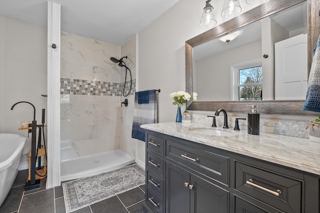 full bath with a soaking tub, tiled shower, tile patterned flooring, and vanity