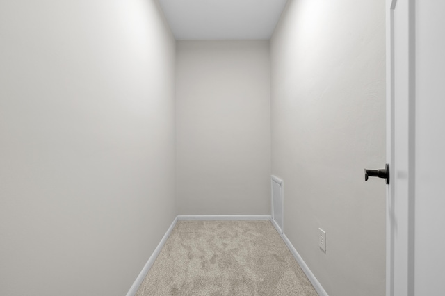 interior space with baseboards and carpet floors