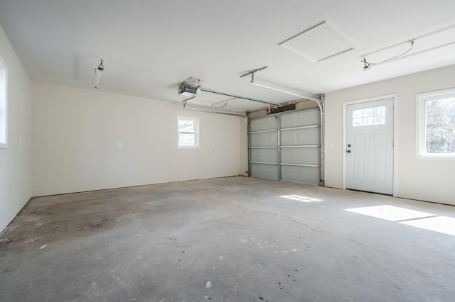 garage featuring a garage door opener