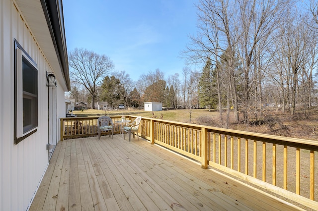 deck with a storage shed and an outdoor structure