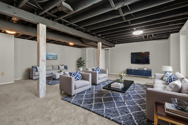 living area with baseboards and carpet