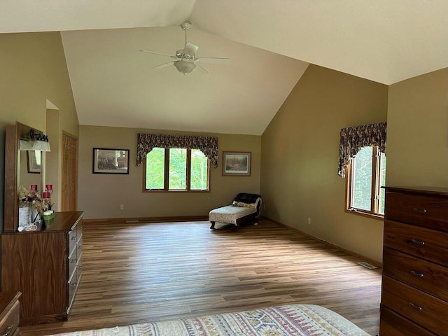 sitting room featuring ceiling fan, baseboards, lofted ceiling, and wood finished floors