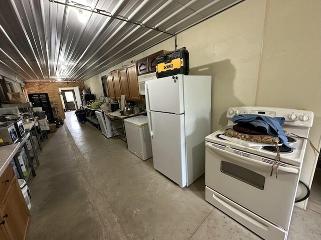 kitchen with white appliances and unfinished concrete flooring