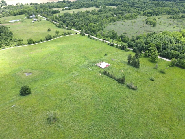 birds eye view of property with a rural view