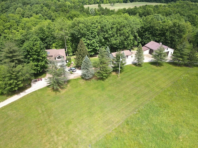 bird's eye view featuring a wooded view