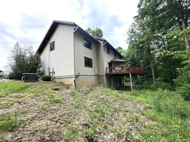 view of home's exterior featuring a deck