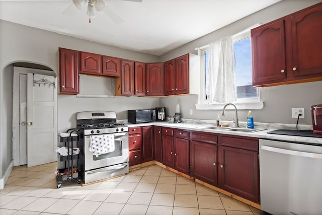 kitchen featuring a sink, light countertops, dark brown cabinets, and stainless steel appliances