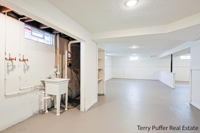 below grade area featuring a textured ceiling