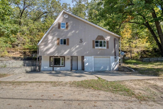 view of front of property with a garage and driveway