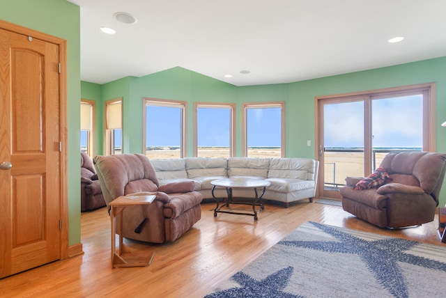 living room featuring light wood-style flooring and recessed lighting