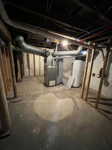 unfinished below grade area with water heater and heating unit