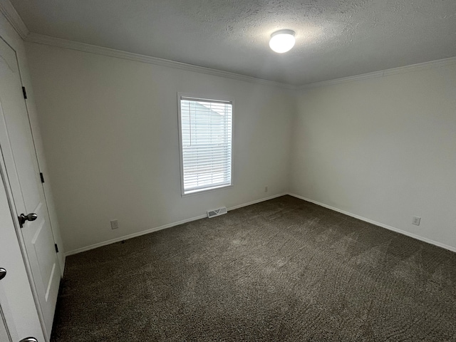 unfurnished bedroom featuring visible vents, a textured ceiling, dark carpet, and crown molding