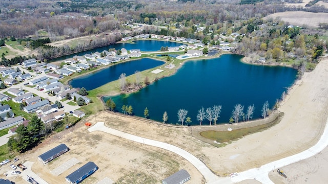 aerial view with a water view and a residential view