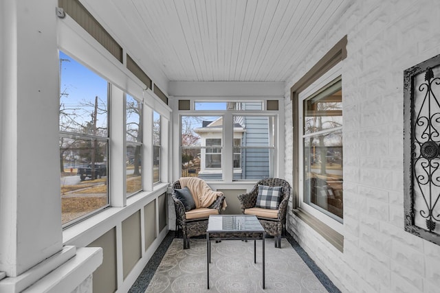 sunroom with a wealth of natural light and wood ceiling