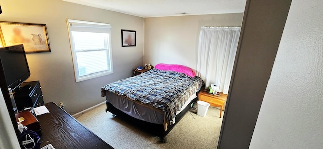 bedroom with baseboards, carpet floors, and visible vents