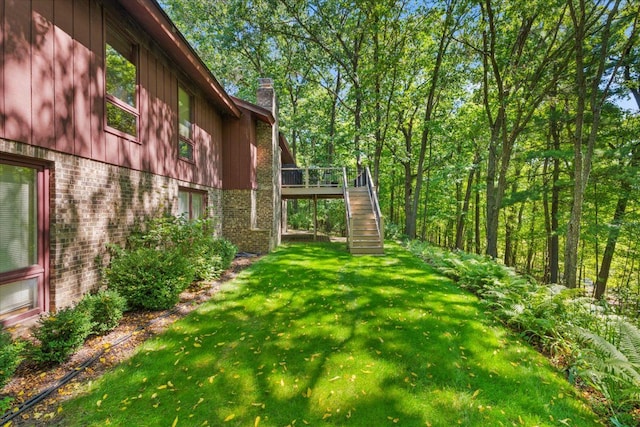 view of yard featuring stairway and a wooden deck